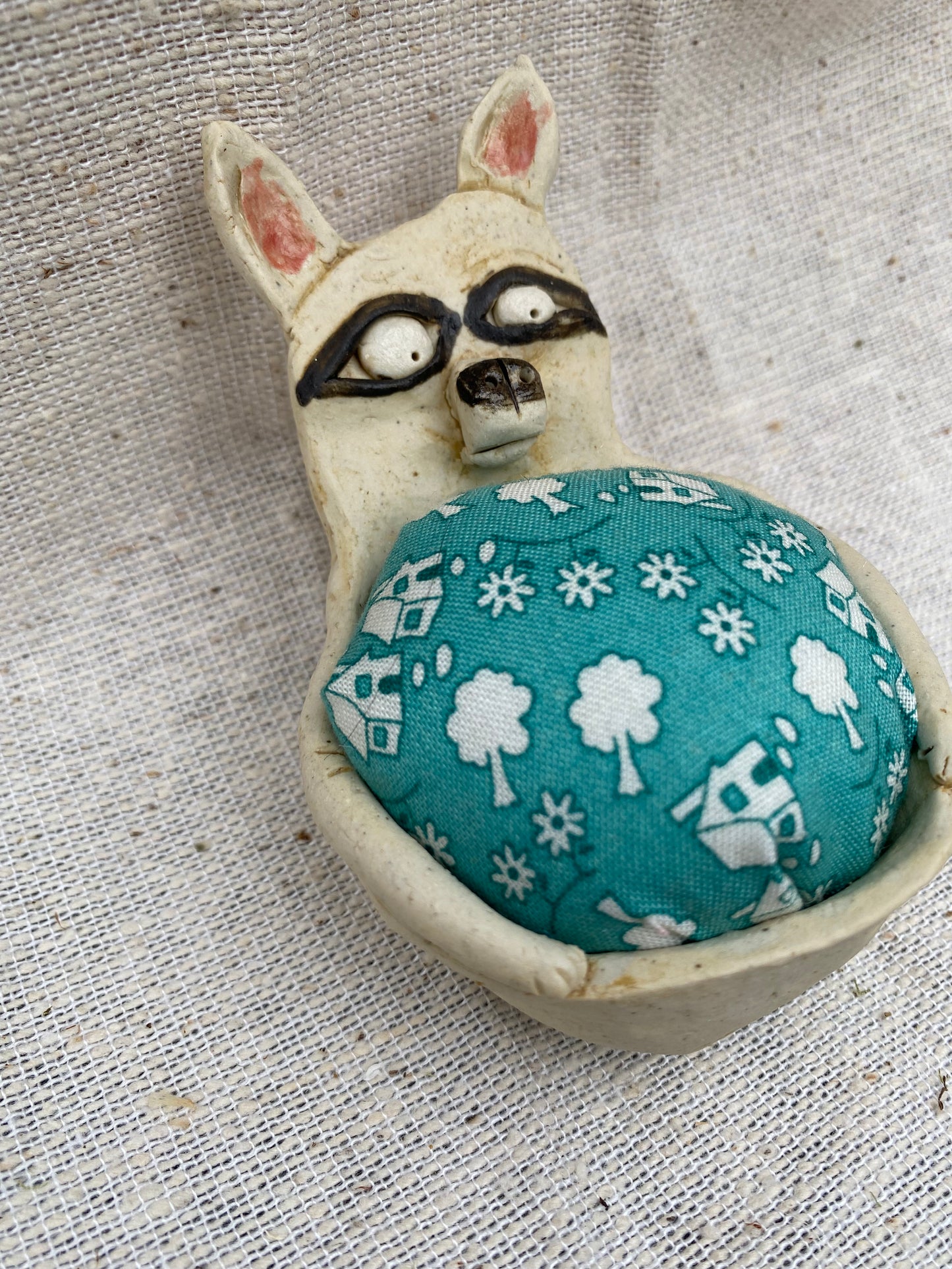 Trash panda pin cushion